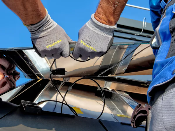 Installer wiring a solar inverter